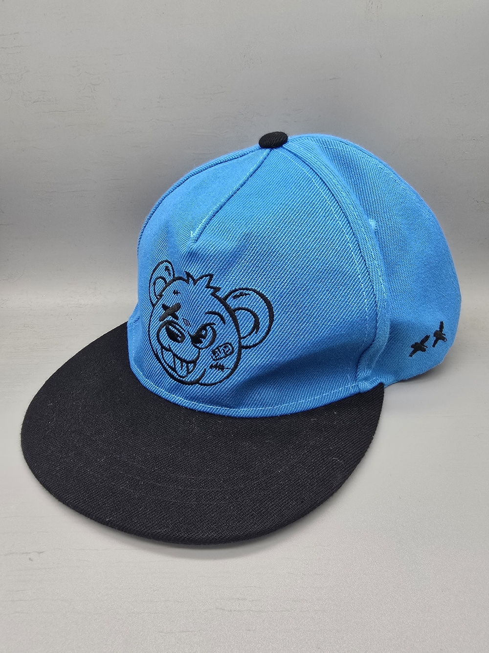 URBN IDNTY Blue and Black Snapback Cap with Bear Graphic